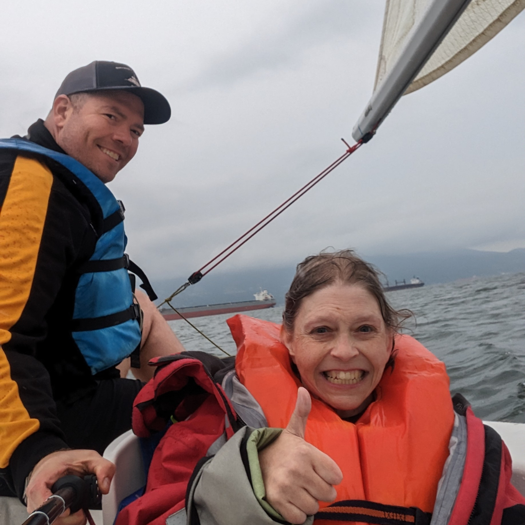 Sean sailing with a client at Jericho Beach